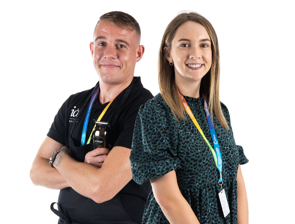 An image showing a smiling male and female staff member of Coleg Cambria