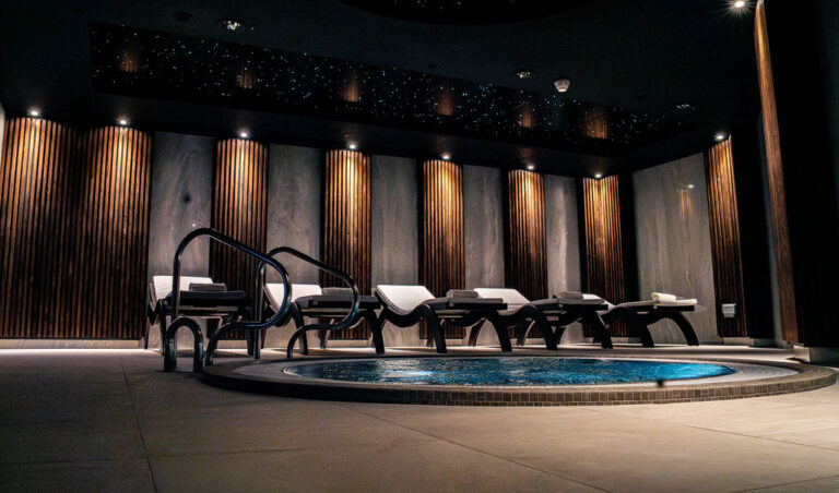 five empty loungers by the hot tub at ial Spa in Wrexham