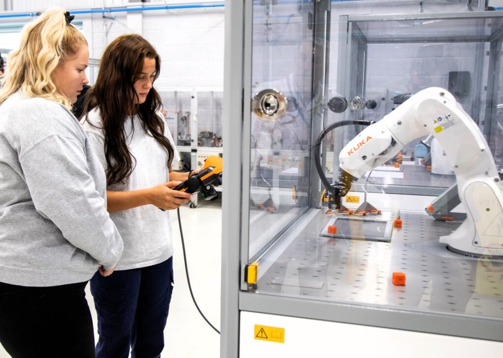two female students in an engineering environment for the news story Building the Future Starts Here – Engineering Lecturing Roles Now Open