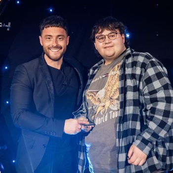 Photo of Ashley Littlemore recieving a student award