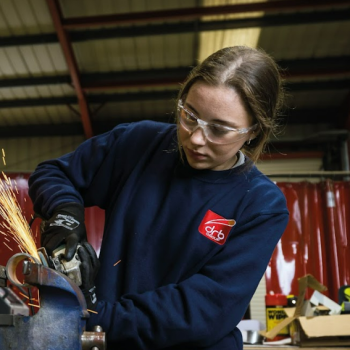 An engineering student with safety glasses on